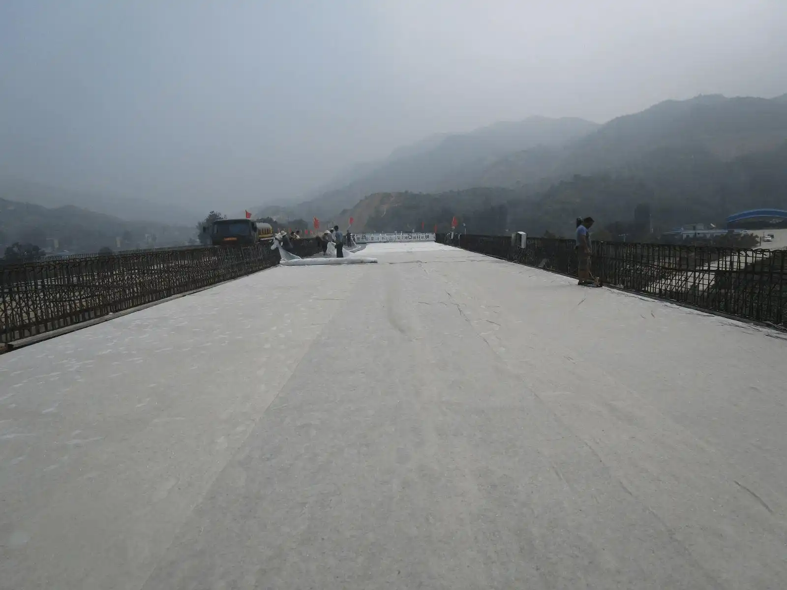 Pavement moisture geotextile construction